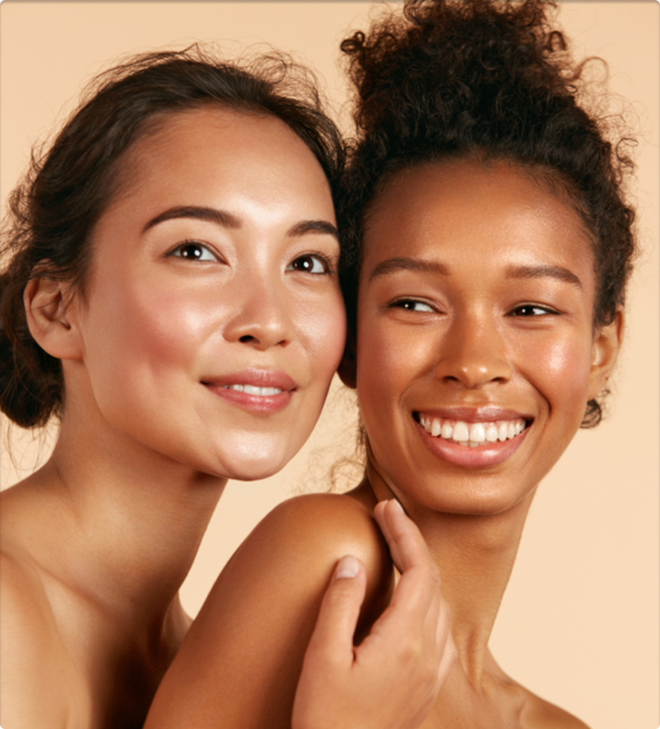 Beauty. Smiling women with perfect face skin and natural makeup portrait. Beautiful happy asian and african girl models with different types of skin on beige background. Spa skin care concept